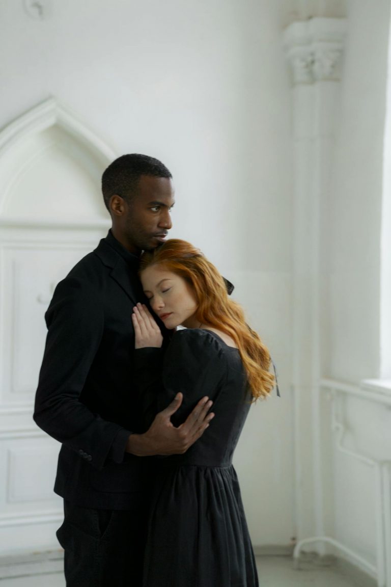 A couple embraces in a serene church setting, symbolizing love and connection.